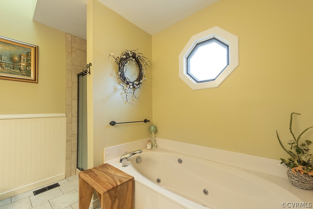 4708 Twin Cedars Road Chester, VA 23831 - Photo 25 of 38 a bathroom with a tub sink and mirror