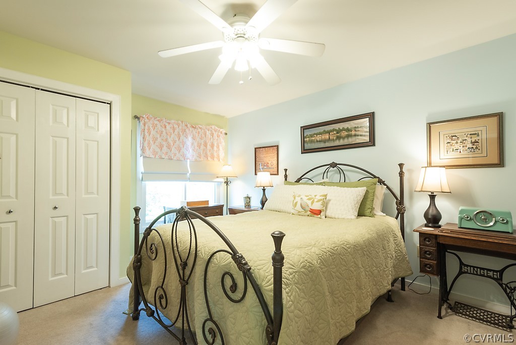 4708 Twin Cedars Road Chester, VA 23831 - Photo 31 of 38 a bedroom with a bed and a chandelier
