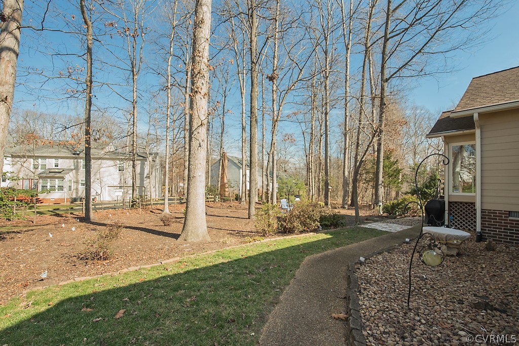 4708 Twin Cedars Road Chester, VA 23831 - Photo 36 of 38 a backyard of a house with table and chairs