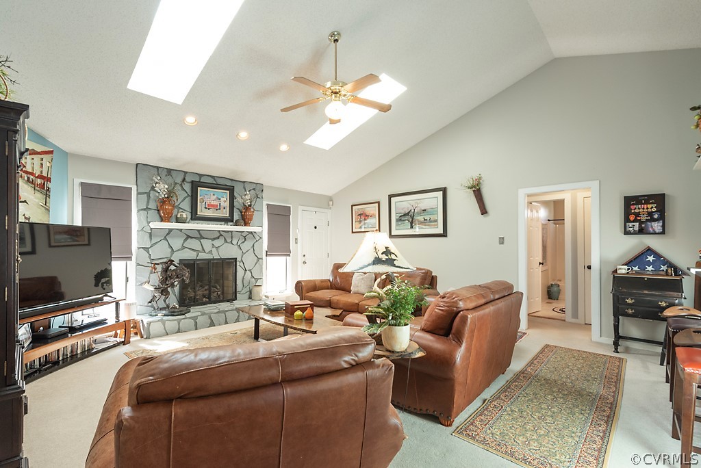 4708 Twin Cedars Road Chester, VA 23831 - Photo 10 of 38 a living room with furniture a flat screen tv and a fireplace