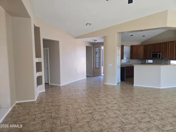 a spacious bathroom with a granite countertop sink a mirror and a vanity