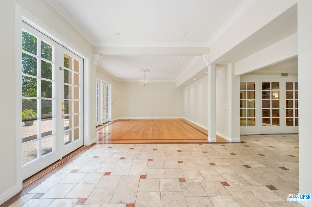 3290 Malcolm Avenue Los Angeles, CA 90034 - Photo 20 of 58 a view of a livingroom with wooden floor and a large window