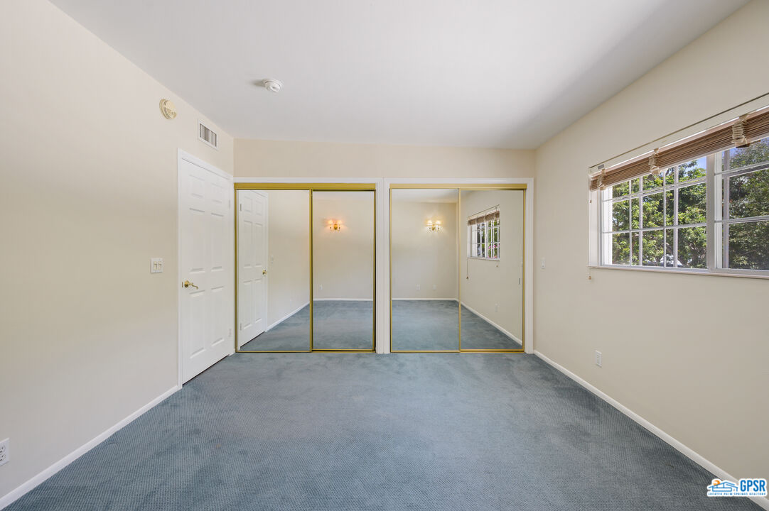 3290 Malcolm Avenue Los Angeles, CA 90034 - Photo 31 of 58 wooden floor in an empty room with a window