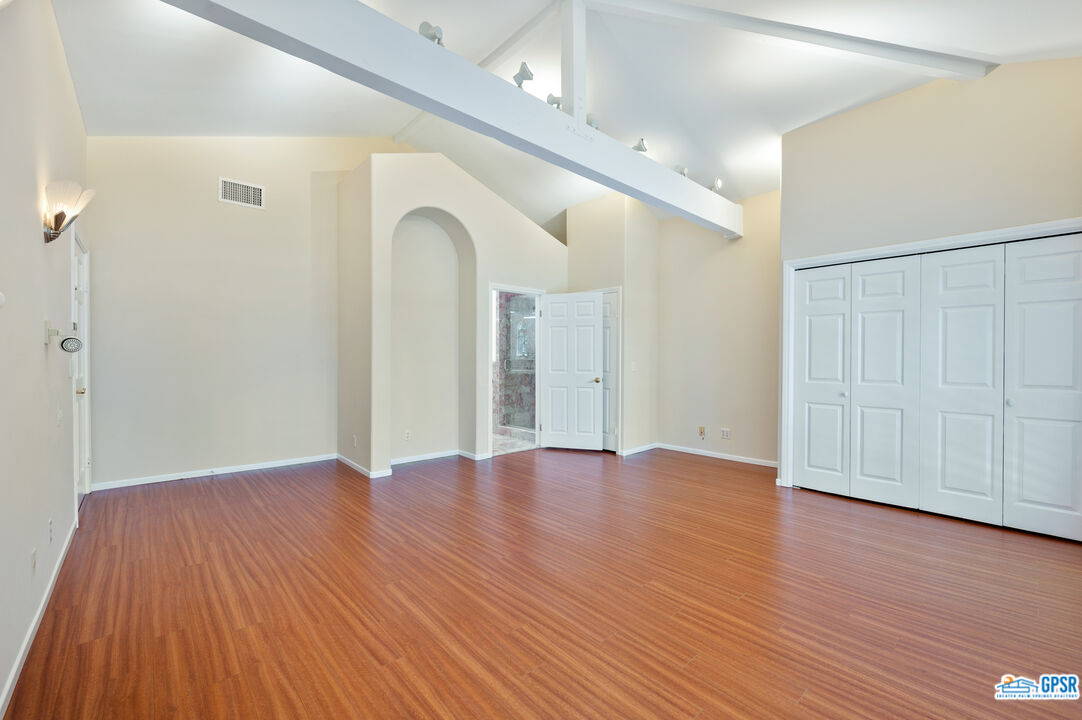 3290 Malcolm Avenue Los Angeles, CA 90034 - Photo 37 of 58 a view of an empty room with wooden floor