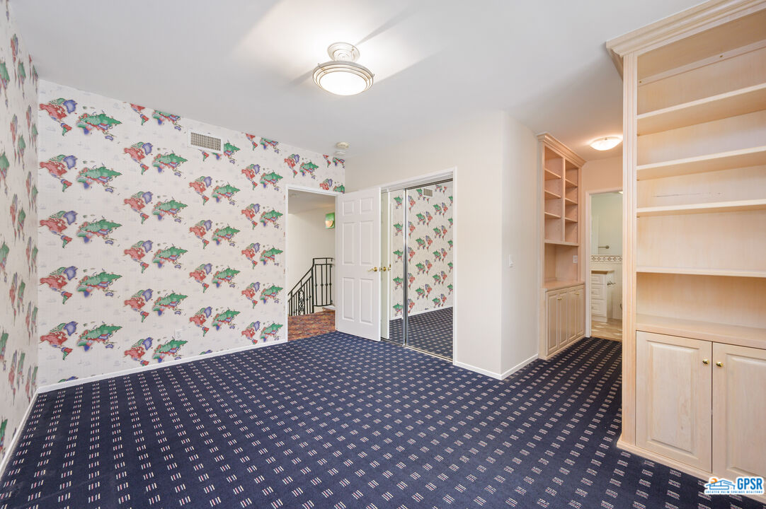 3290 Malcolm Avenue Los Angeles, CA 90034 - Photo 41 of 58 a bedroom with a bed and a cabinets