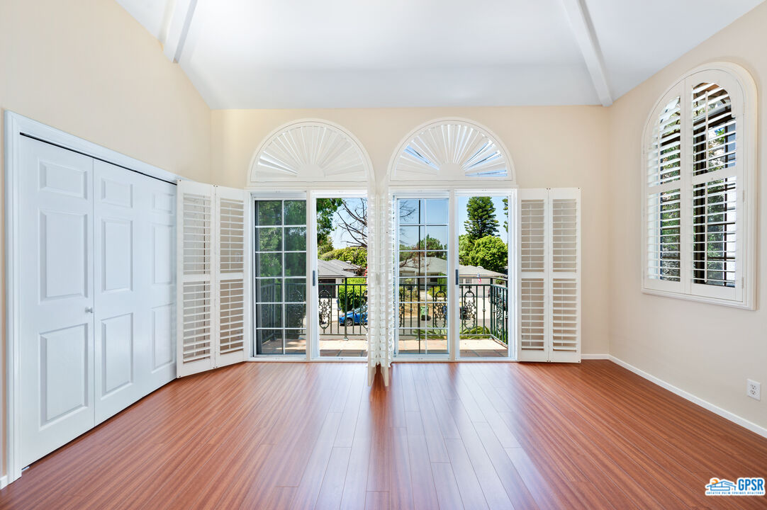 3290 Malcolm Avenue Los Angeles, CA 90034 - Photo 46 of 58 a view of room with wooden floor and windows