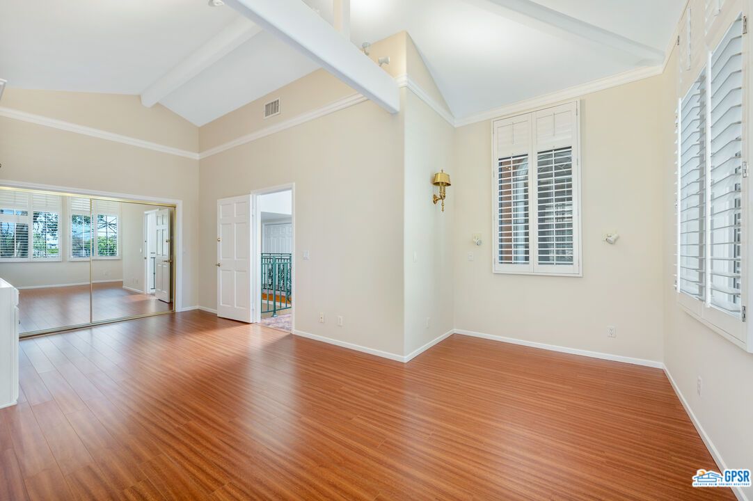 3290 Malcolm Avenue Los Angeles, CA 90034 - Photo 47 of 58 a view of empty room with wooden floor and fan