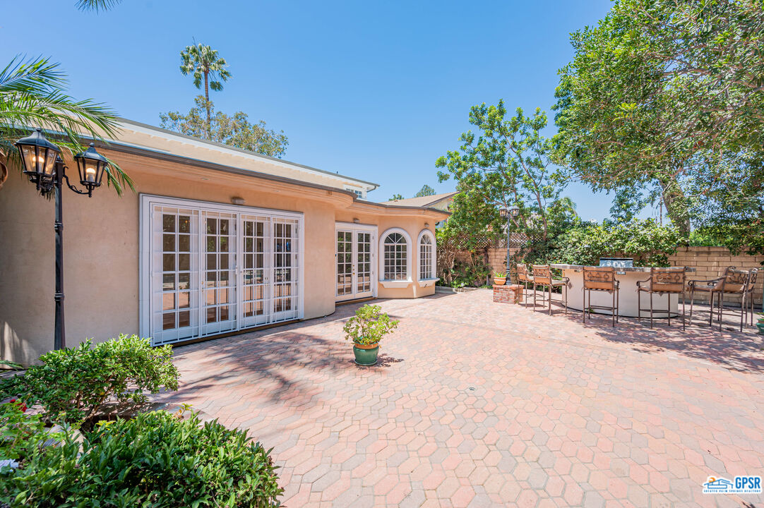 3290 Malcolm Avenue Los Angeles, CA 90034 - Photo 49 of 58 a view of a house with backyard and sitting area