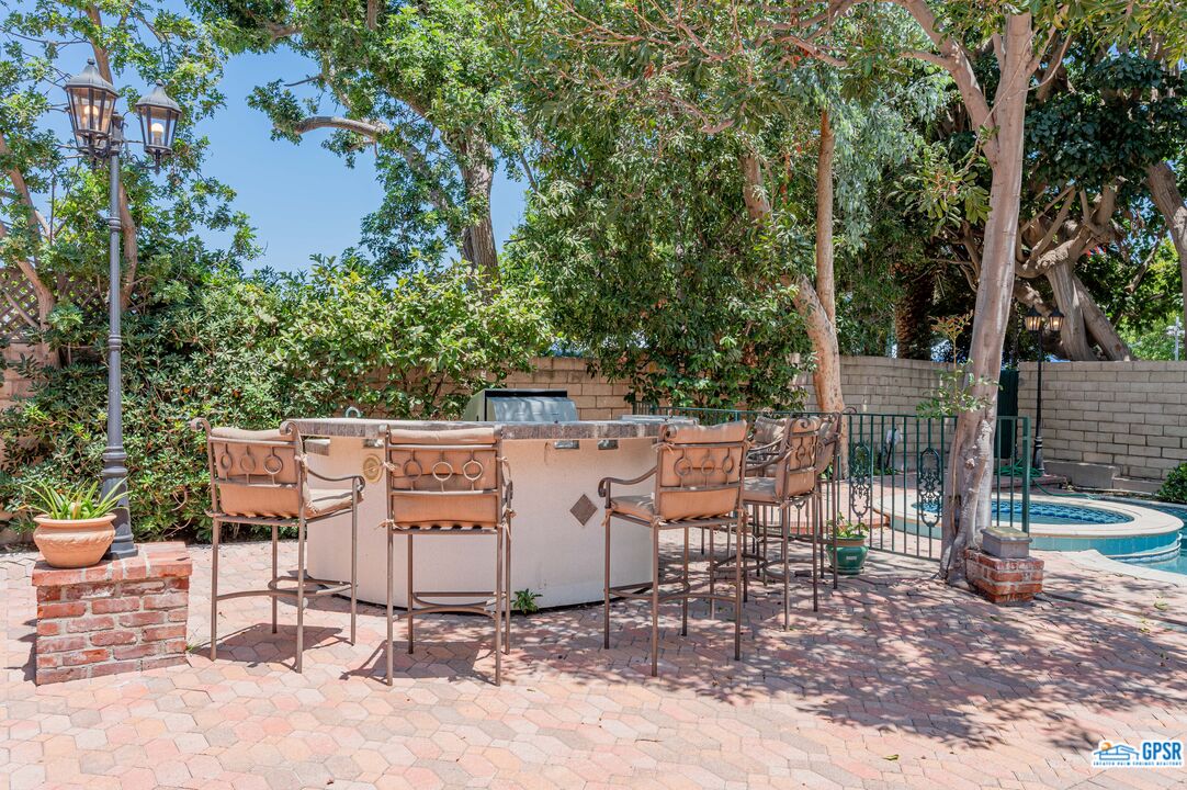 3290 Malcolm Avenue Los Angeles, CA 90034 - Photo 53 of 58 a view of a chairs and table in the backyard