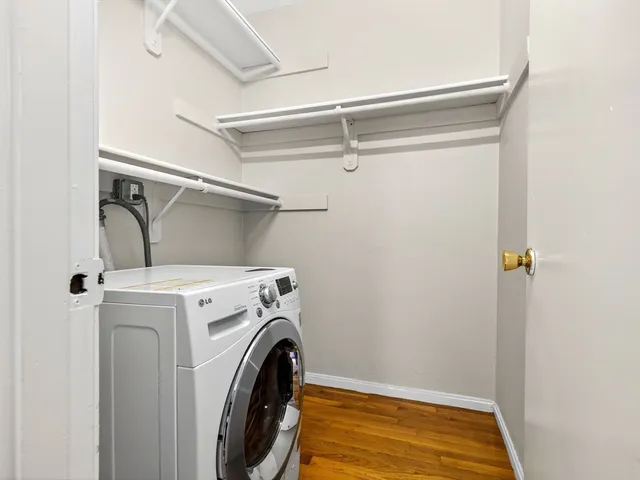 a view of a storage & utility room with dryer and washer