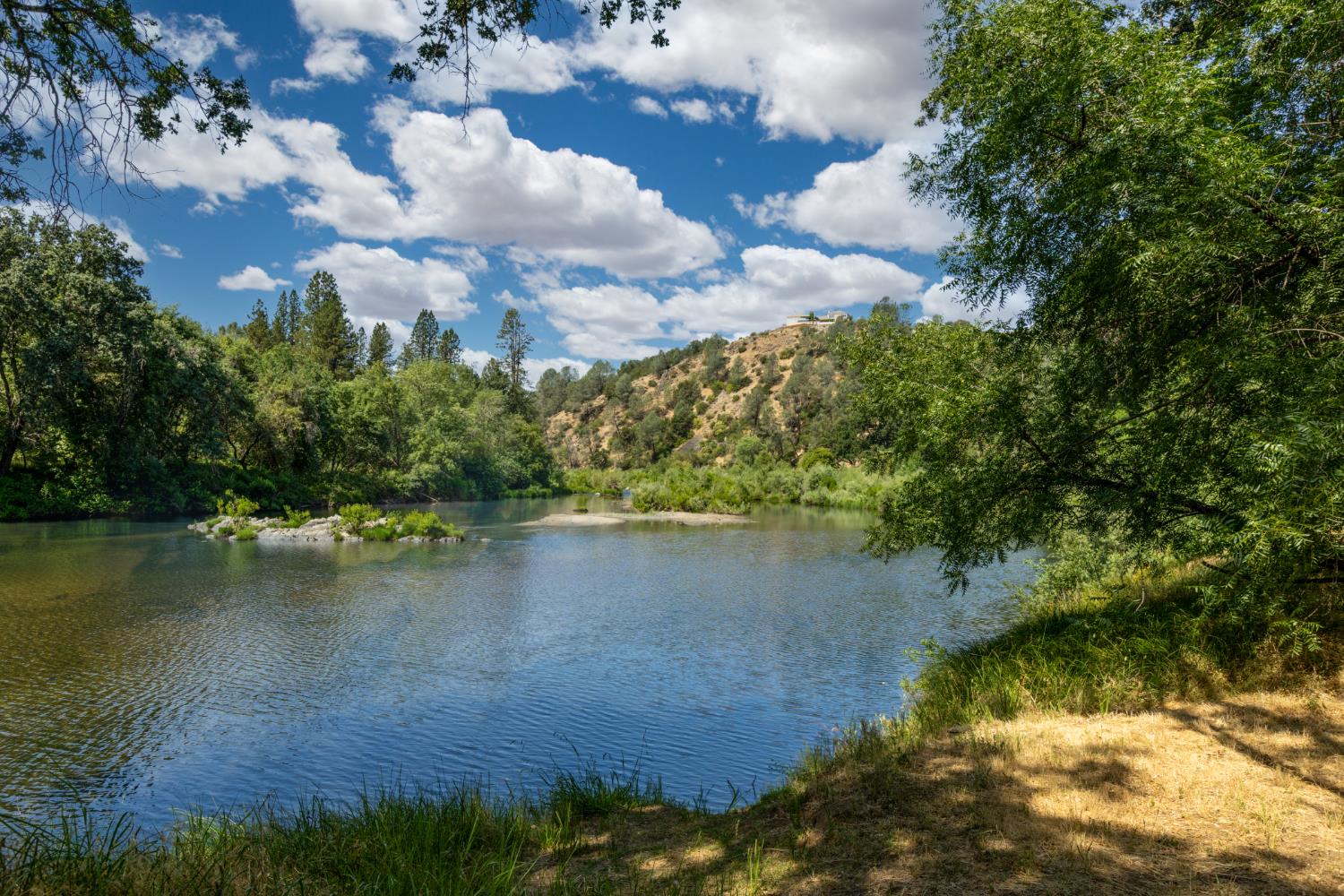 8489 White Hawk Road Shingle Springs, CA 95682 - Photo 7 of 23 a view of a lake with houses