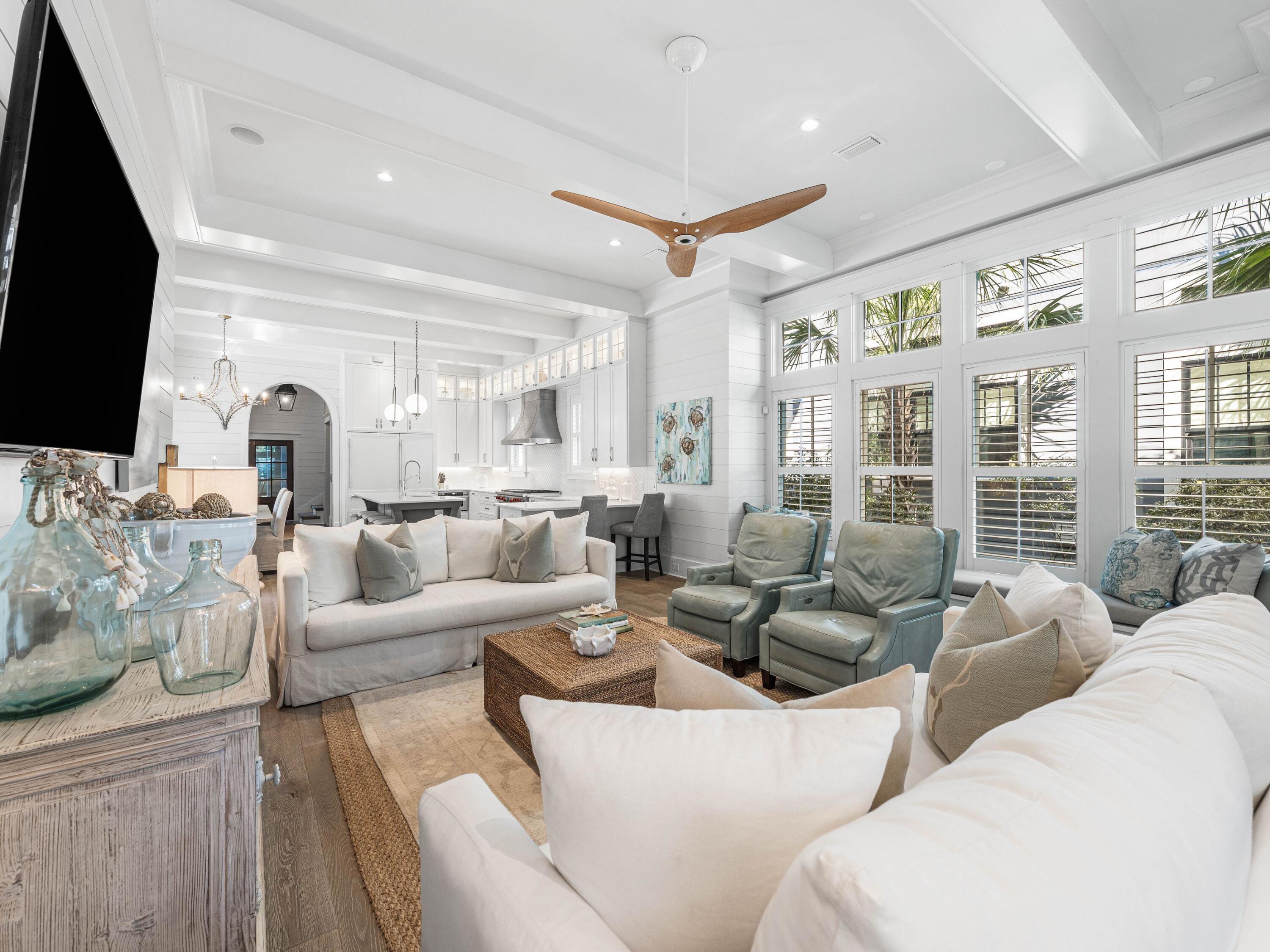 52 North Shingle Lane Watersound, FL 32461 - Photo 11 of 66 a living room with furniture fireplace and a flat screen tv
