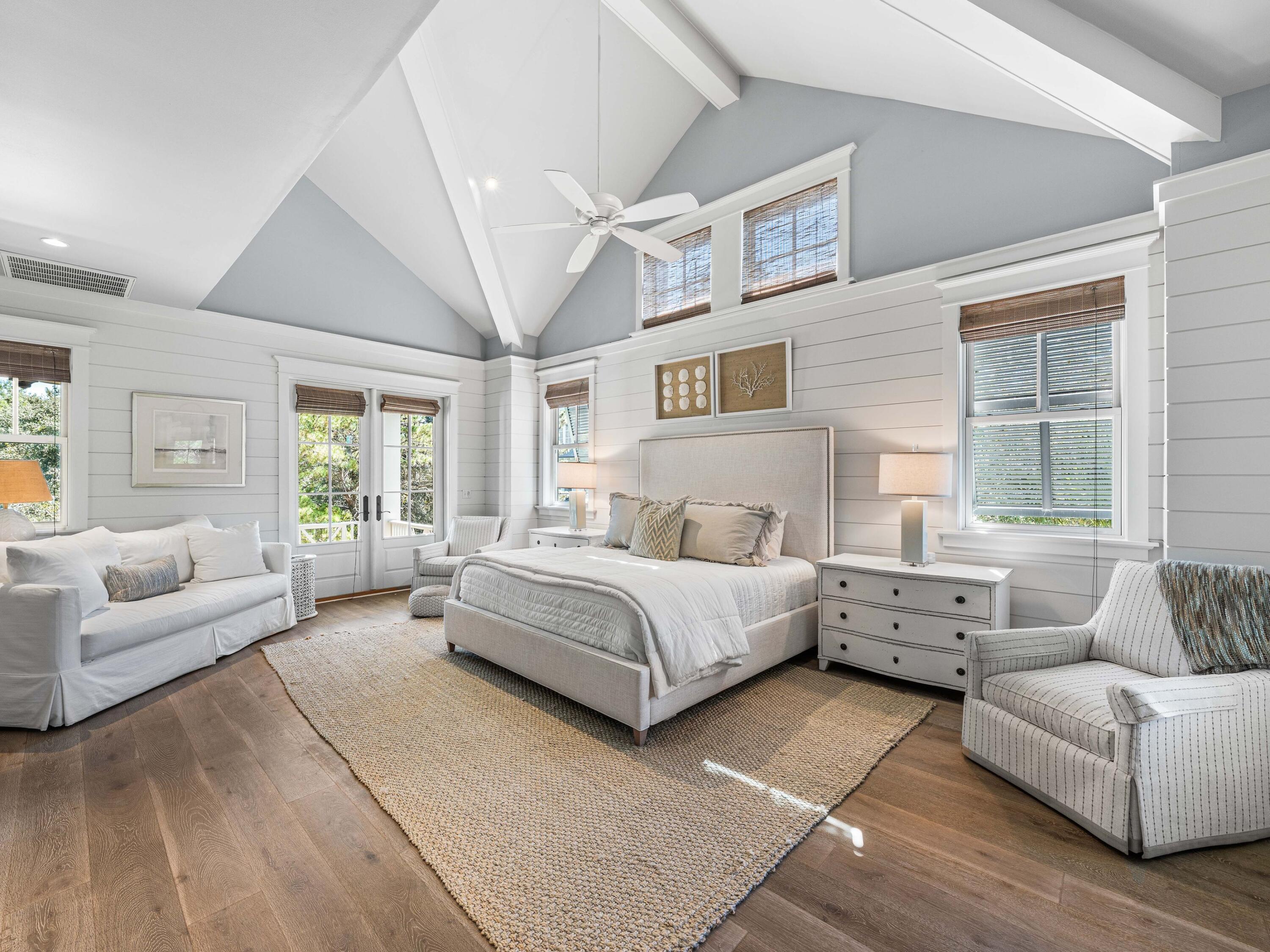 52 North Shingle Lane Watersound, FL 32461 - Photo 12 of 66 a spacious bedroom with a bed a couch and window