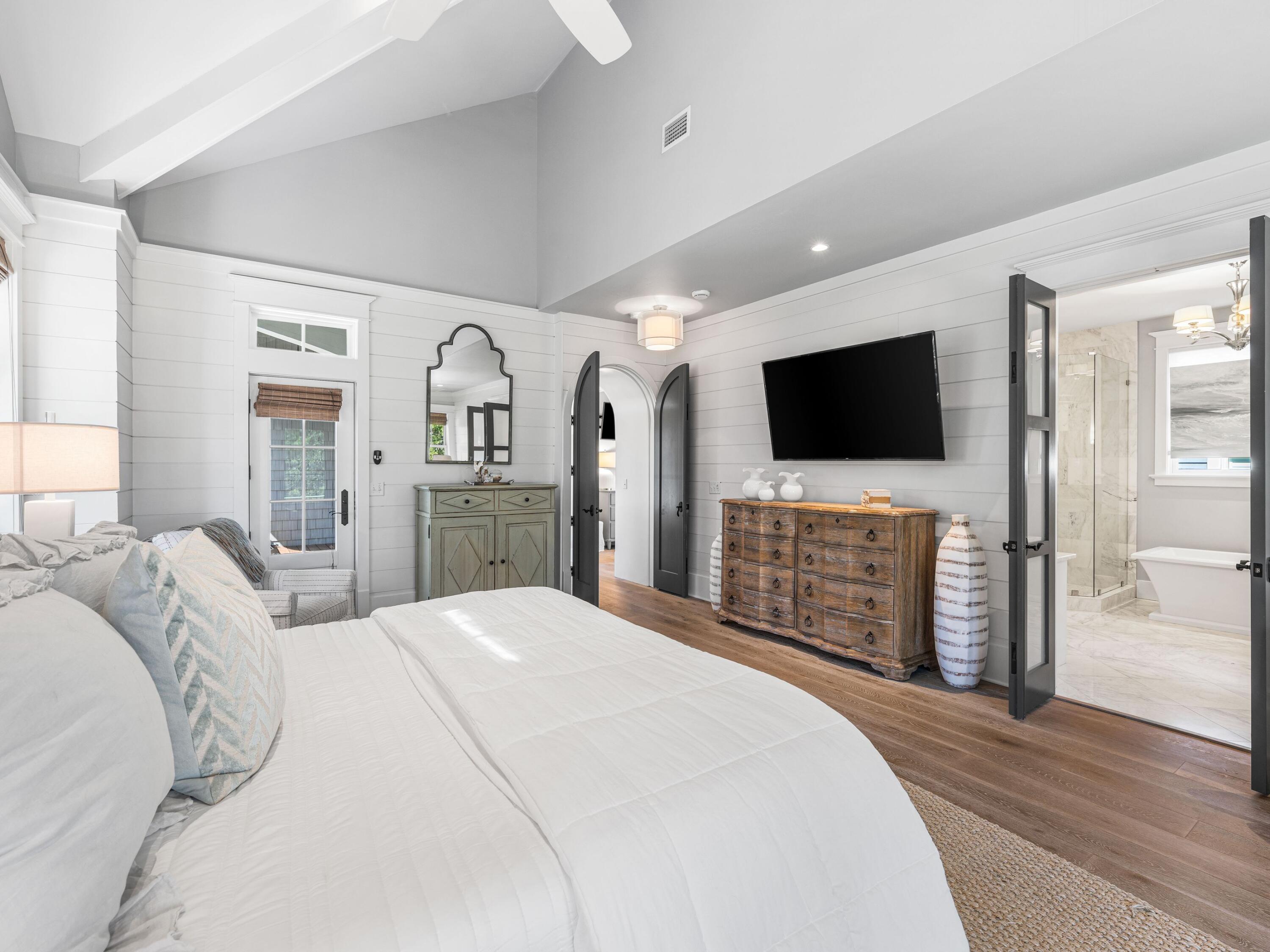 52 North Shingle Lane Watersound, FL 32461 - Photo 15 of 66 a bedroom with a bed and a flat screen tv