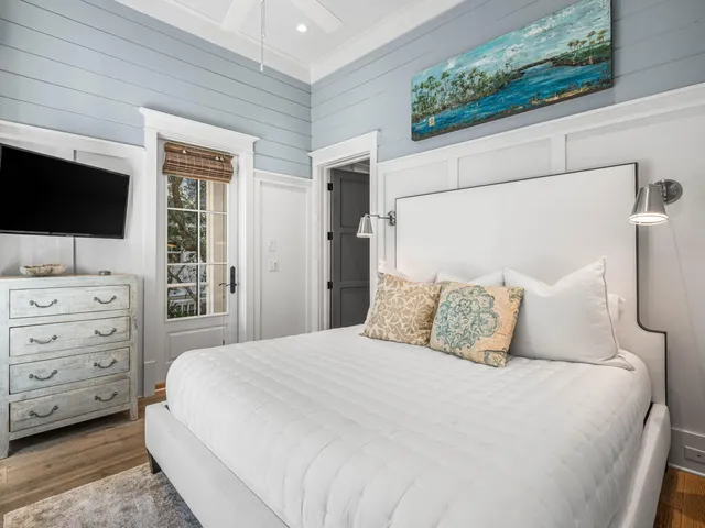 a living room with patio furniture and a floor to ceiling window