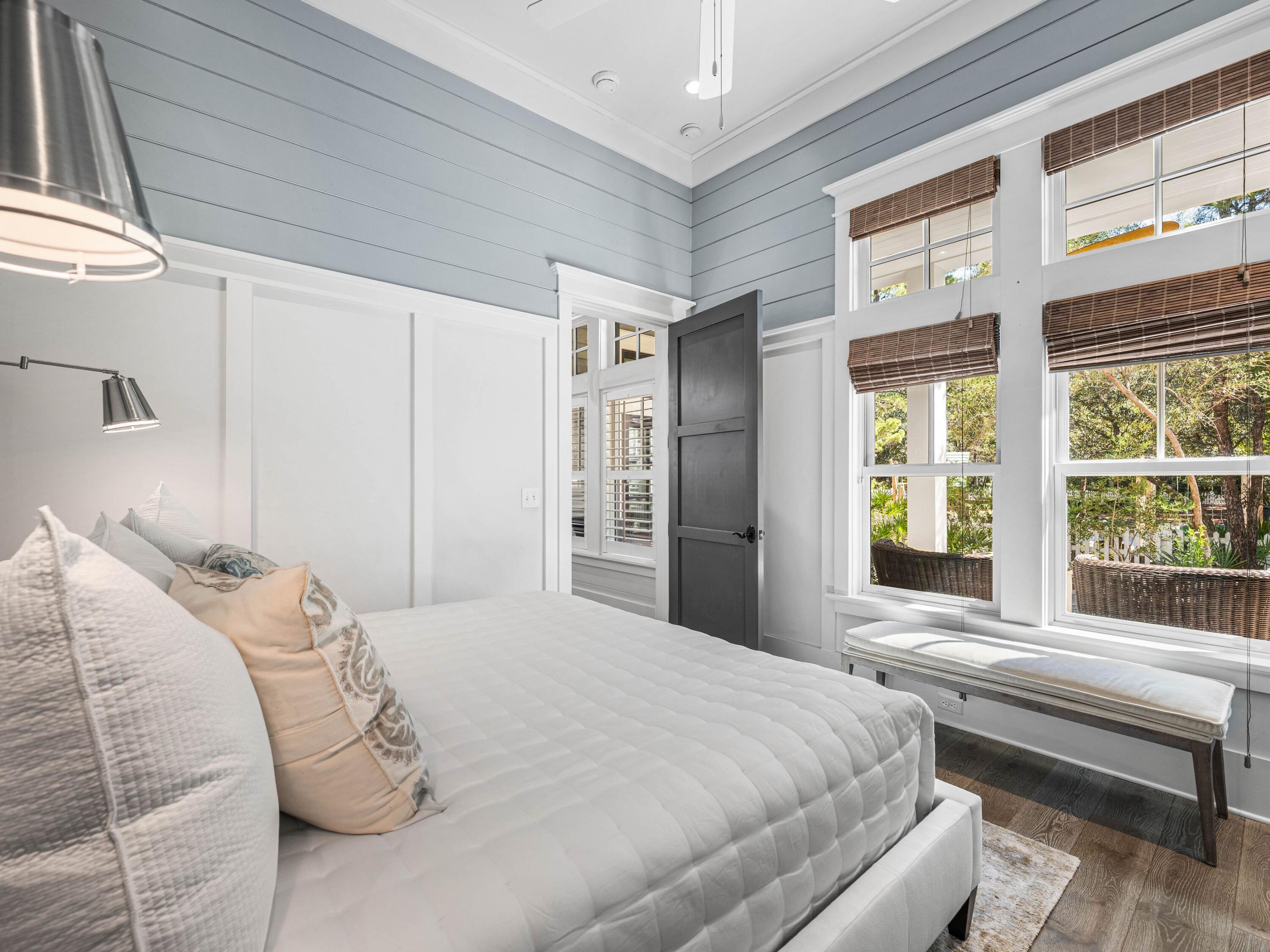 52 North Shingle Lane Watersound, FL 32461 - Photo 23 of 66 a bedroom with a bed and a large window with outer view