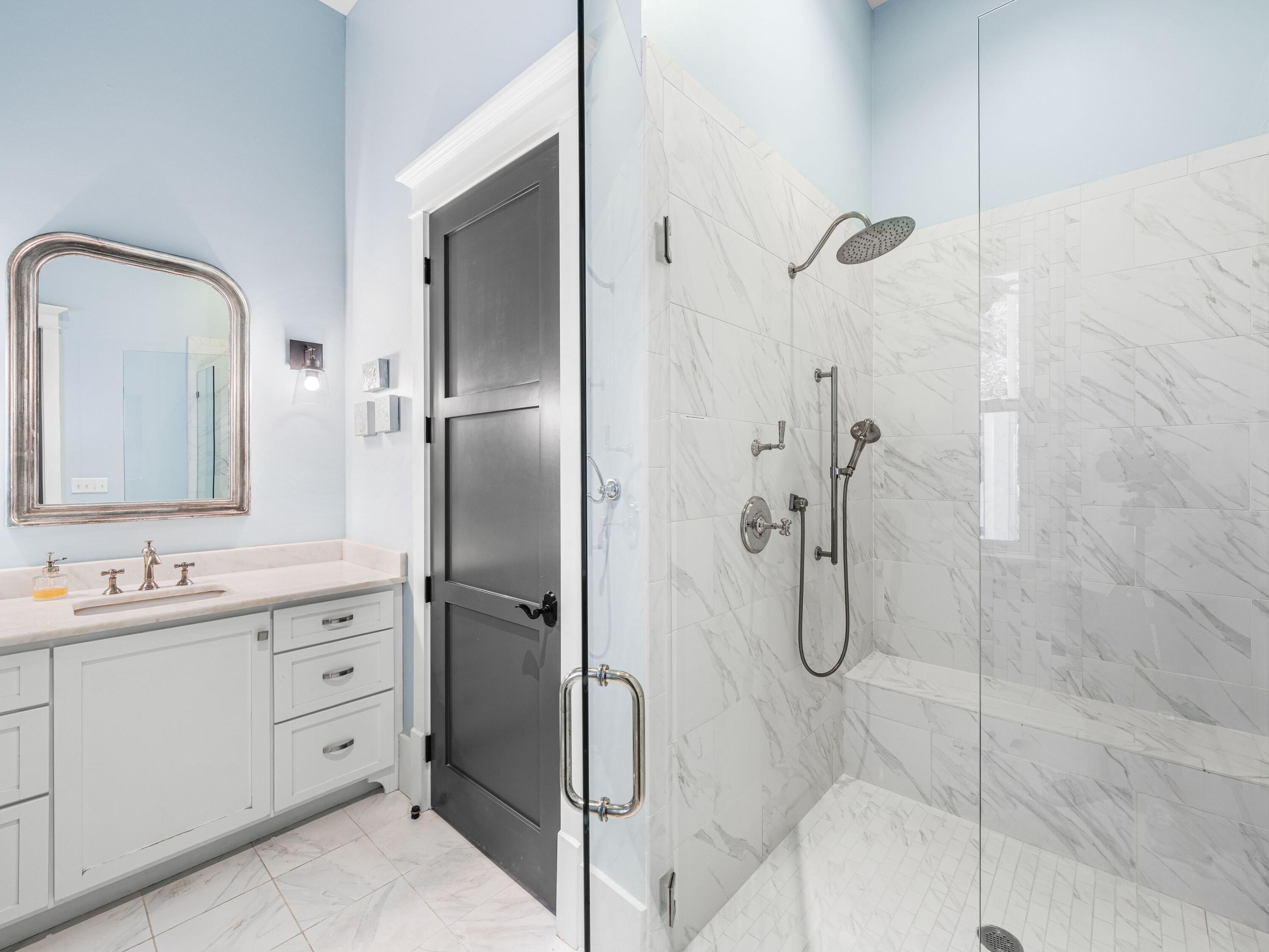 52 North Shingle Lane Watersound, FL 32461 - Photo 24 of 66 a bathroom with a double vanity sink mirror and shower