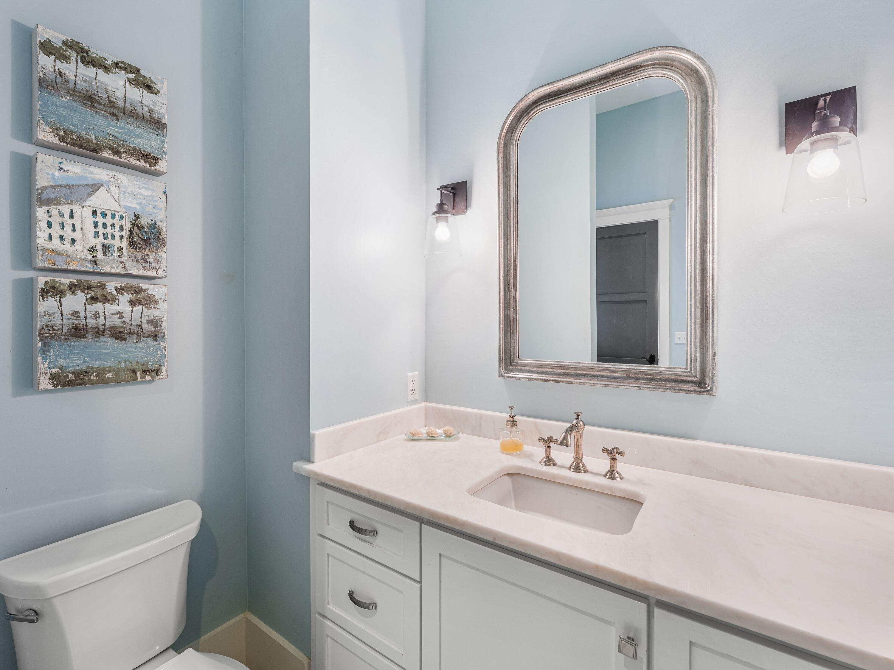 52 North Shingle Lane Watersound, FL 32461 - Photo 25 of 66 a bathroom with a granite countertop sink a toilet and a mirror