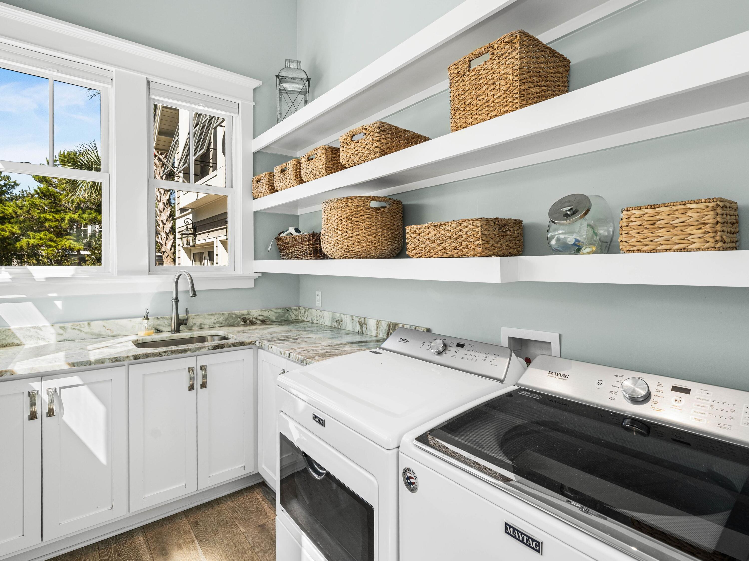 52 North Shingle Lane Watersound, FL 32461 - Photo 32 of 66 a view of cabinets a washer and dryer