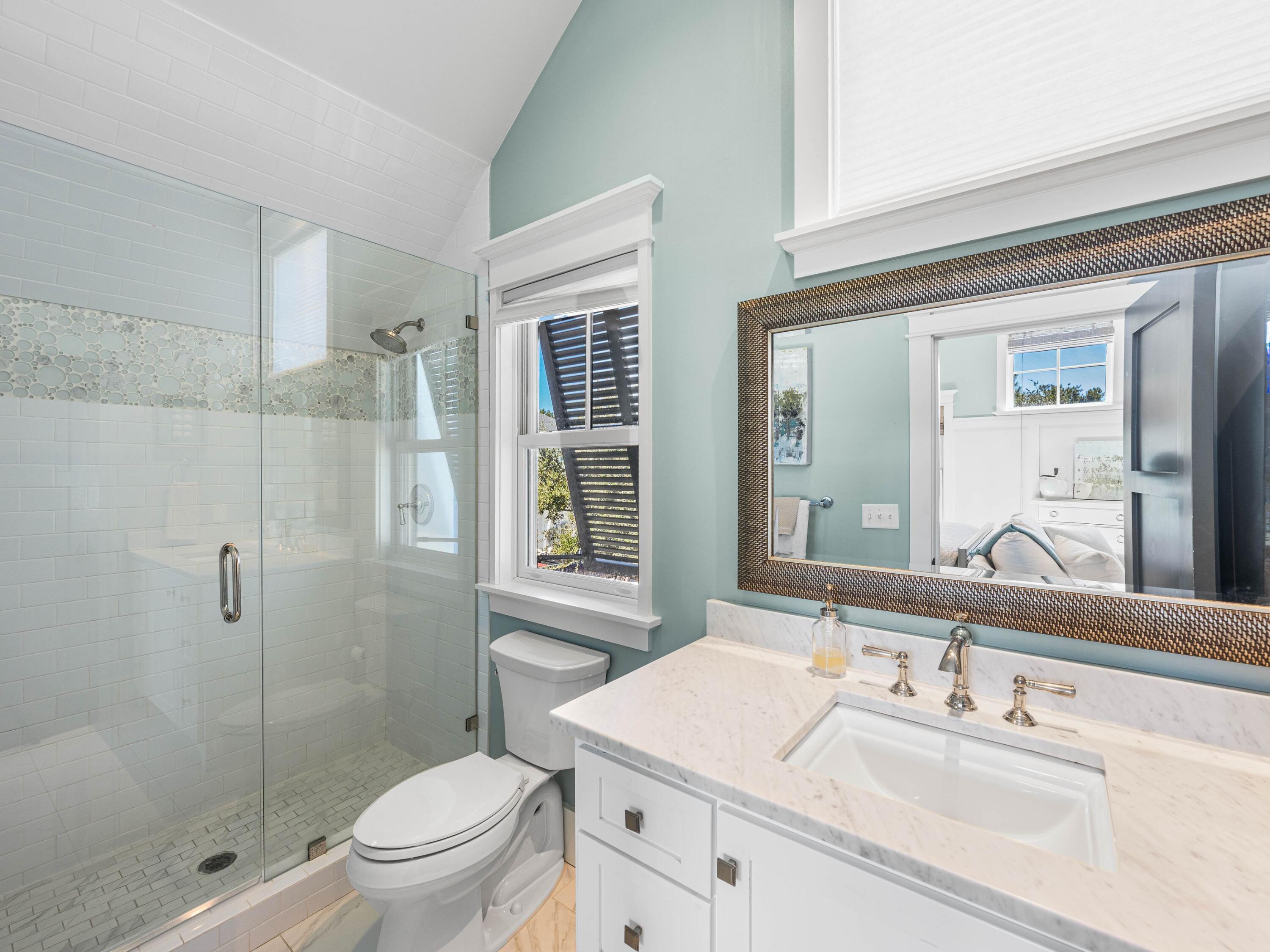 52 North Shingle Lane Watersound, FL 32461 - Photo 39 of 66 a bathroom with a sink toilet vanity and shower