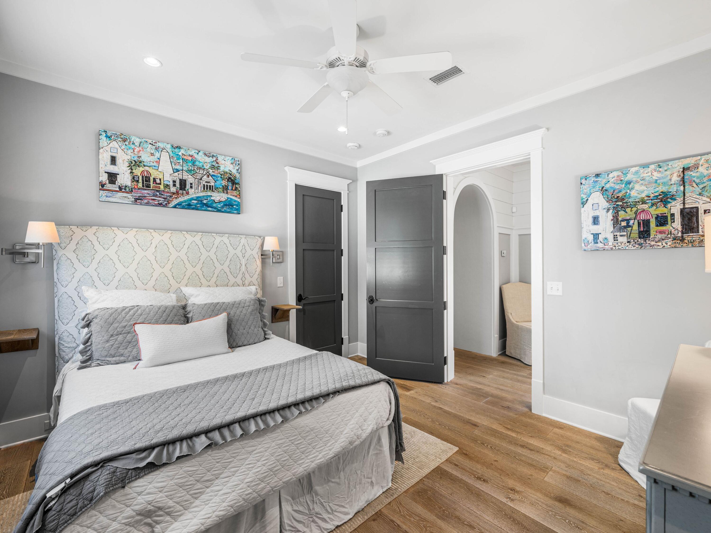 52 North Shingle Lane Watersound, FL 32461 - Photo 47 of 66 a bedroom with a large bed and a chandelier