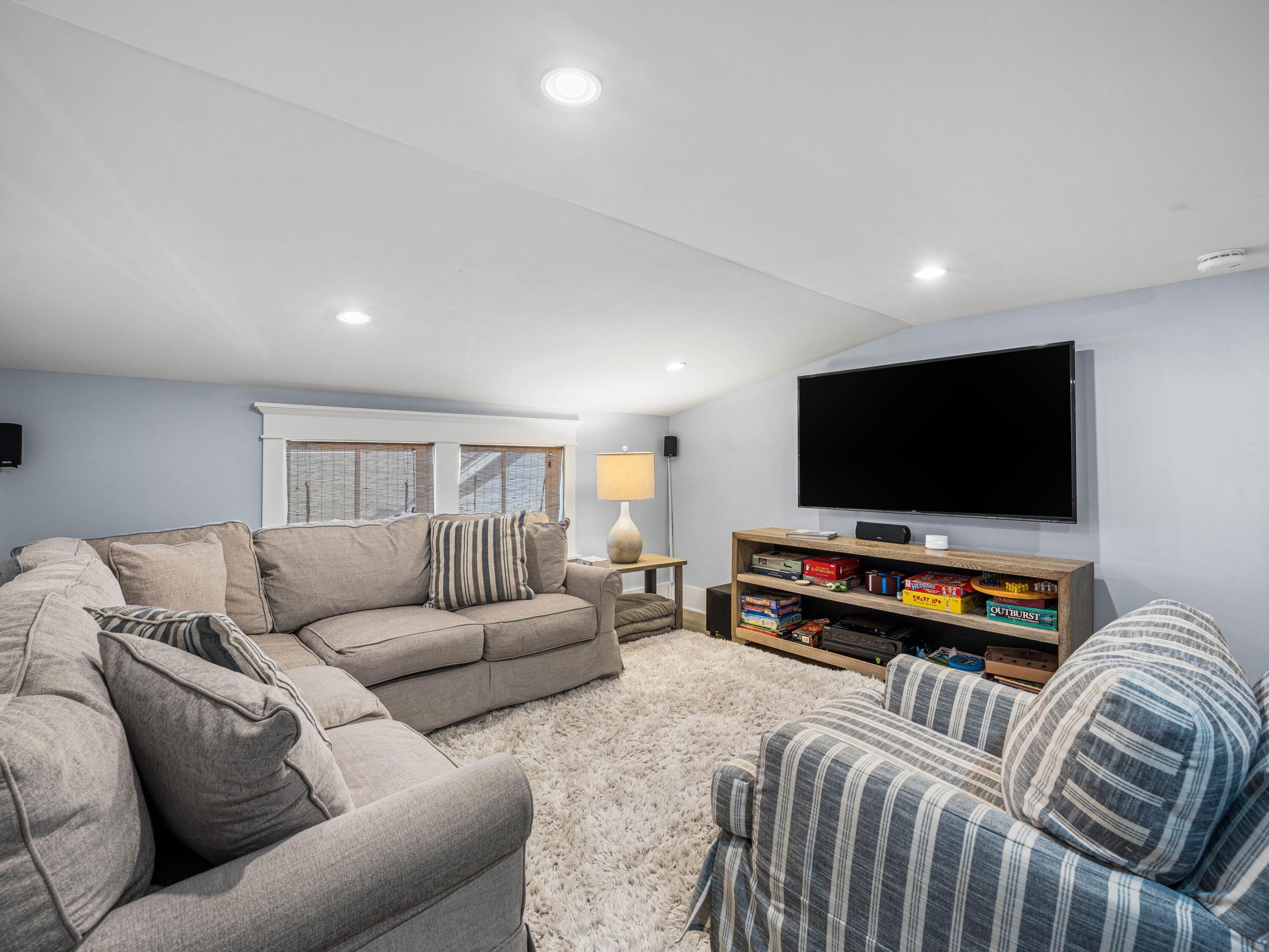 52 North Shingle Lane Watersound, FL 32461 - Photo 50 of 66 a living room with furniture and a flat screen tv