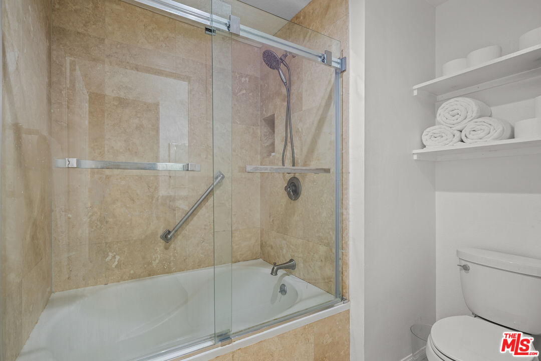 8601 Falmouth Avenue, Unit 404 Playa del Rey, CA 90293 - Photo 14 of 28 a bathroom with a bathtub and a shower
