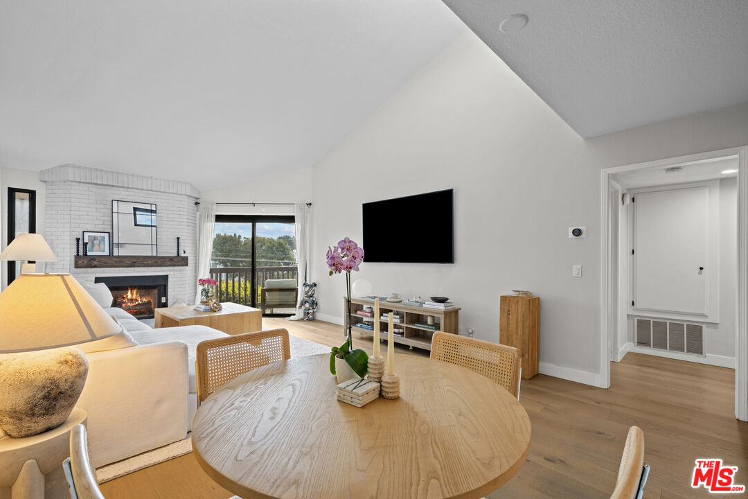 8601 Falmouth Avenue, Unit 404 Playa del Rey, CA 90293 - Photo 2 of 28 a living room with furniture flat screen tv and wooden floor