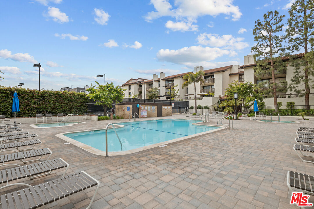 8601 Falmouth Avenue, Unit 404 Playa del Rey, CA 90293 - Photo 23 of 28 a view of a building with a swimming pool