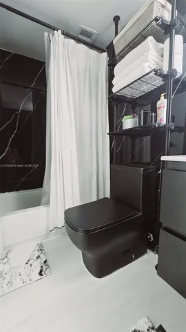 a kitchen with a refrigerator sink and stove