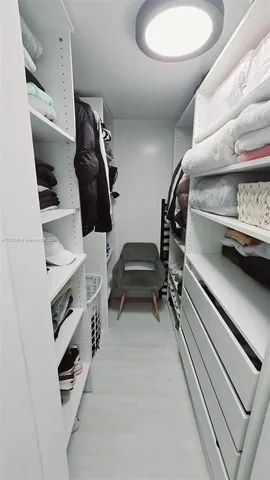 a kitchen with a sink appliances and cabinets