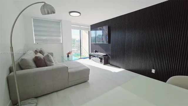 a living room with furniture and a rug