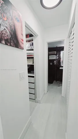 a bed room with a bed and a chair