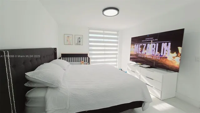 a living room with furniture and a mirror