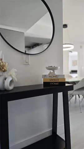 a large white kitchen with a large window