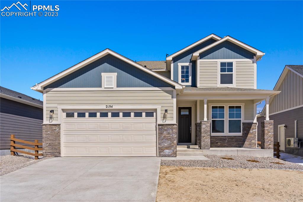 a front view of a house with garage
