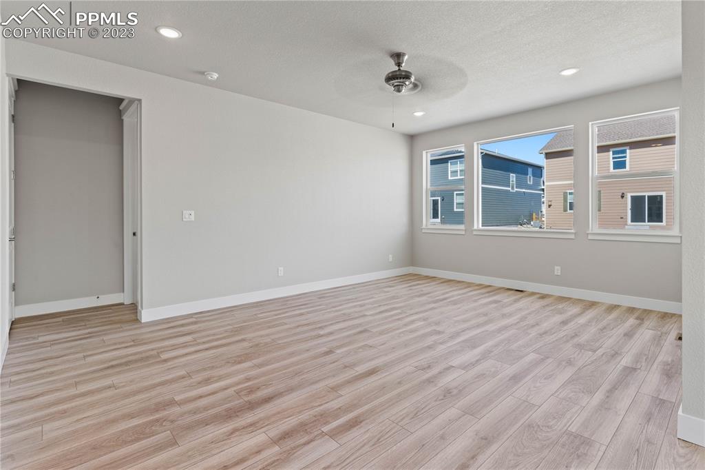 2154 Coyote Mint Drive Monument, CO 80132 - Photo 13 of 46 a view of empty room with wooden floor and fan