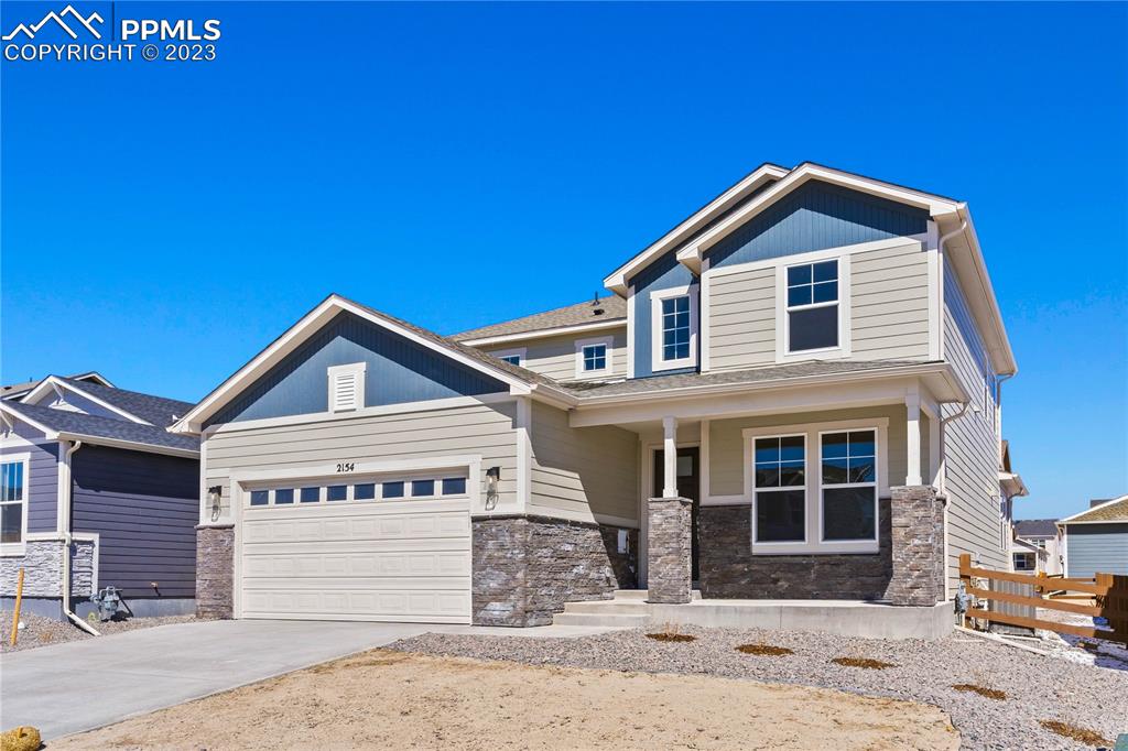 2154 Coyote Mint Drive Monument, CO 80132 - Photo 2 of 46 a front view of a house with a yard