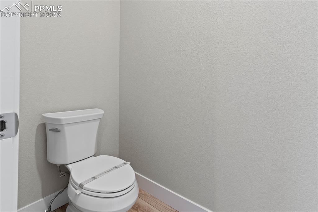 2154 Coyote Mint Drive Monument, CO 80132 - Photo 23 of 46 a white toilet sitting next to a white wall