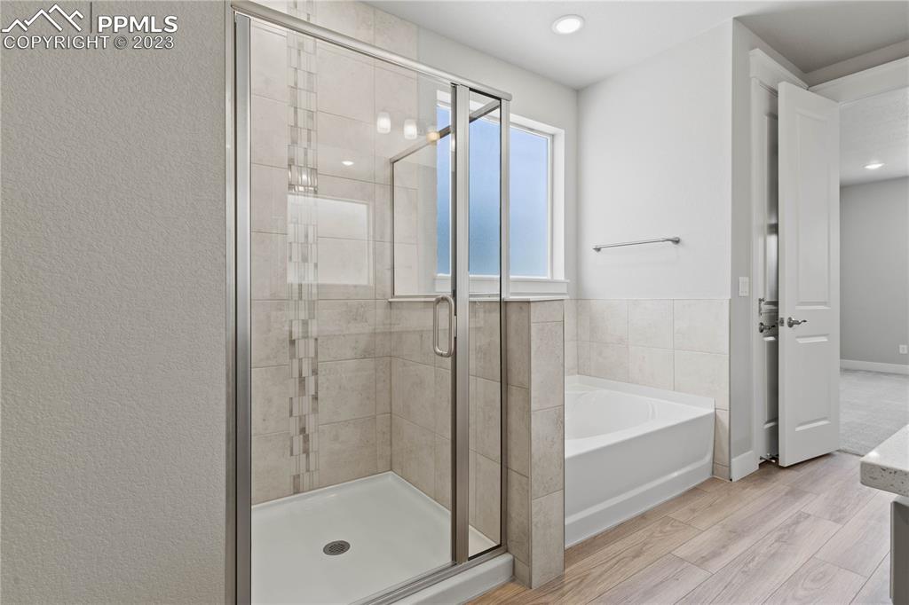 2154 Coyote Mint Drive Monument, CO 80132 - Photo 26 of 46 a bathroom with a glass shower door
