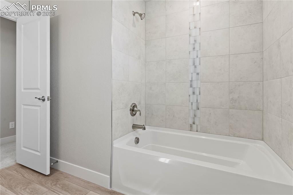 2154 Coyote Mint Drive Monument, CO 80132 - Photo 33 of 46 a bathroom with a bathtub