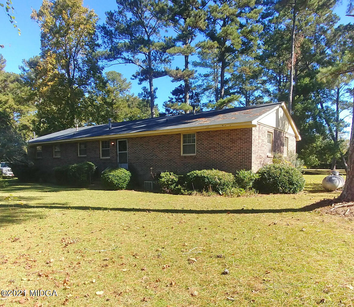 7325 Nowell Road South Macon, GA 31216 - Photo 15 of 18 a front view of a house with a yard