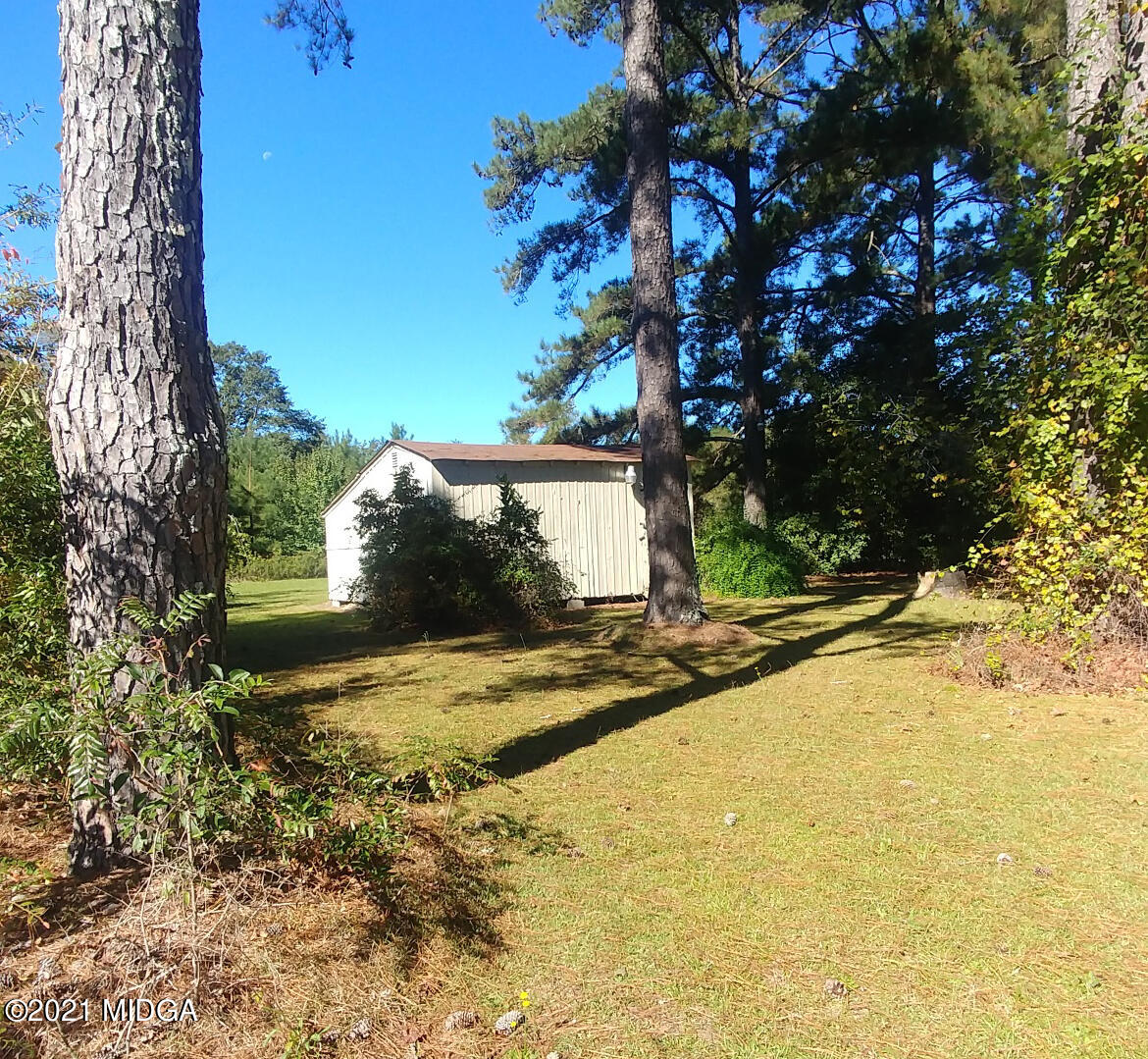 7325 Nowell Road South Macon, GA 31216 - Photo 16 of 18 a view of a yard in front of a house
