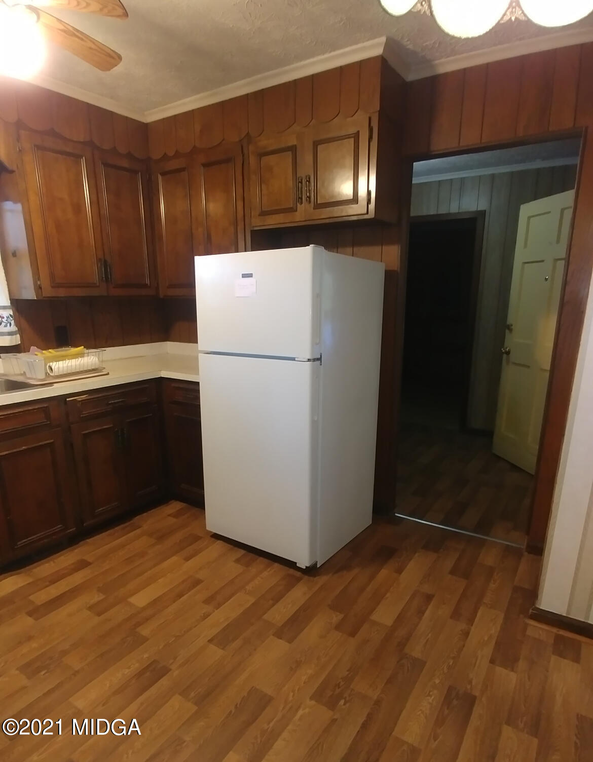 7325 Nowell Road South Macon, GA 31216 - Photo 4 of 18 a white refrigerator freezer sitting inside of a kitchen