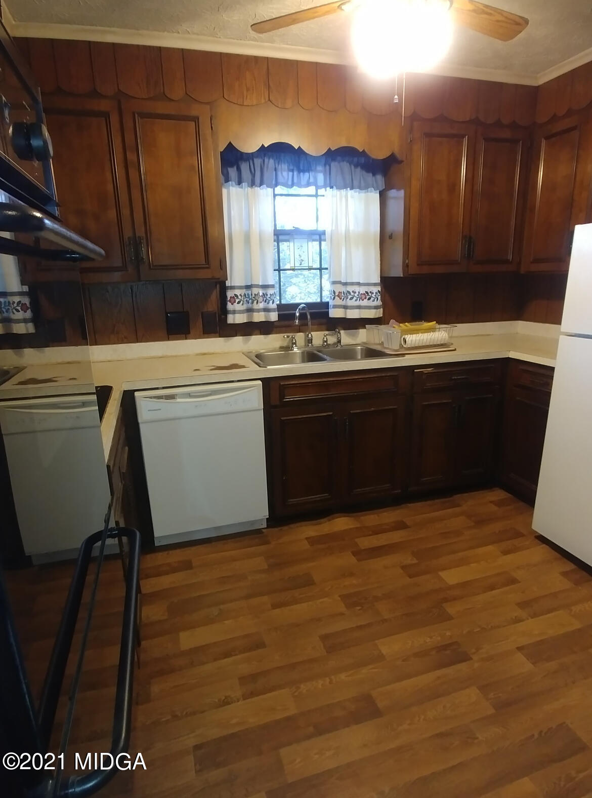 7325 Nowell Road South Macon, GA 31216 - Photo 6 of 18 a kitchen with stainless steel appliances granite countertop a stove a sink and a microwave