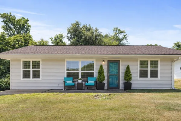 a view of a house with pool and porch