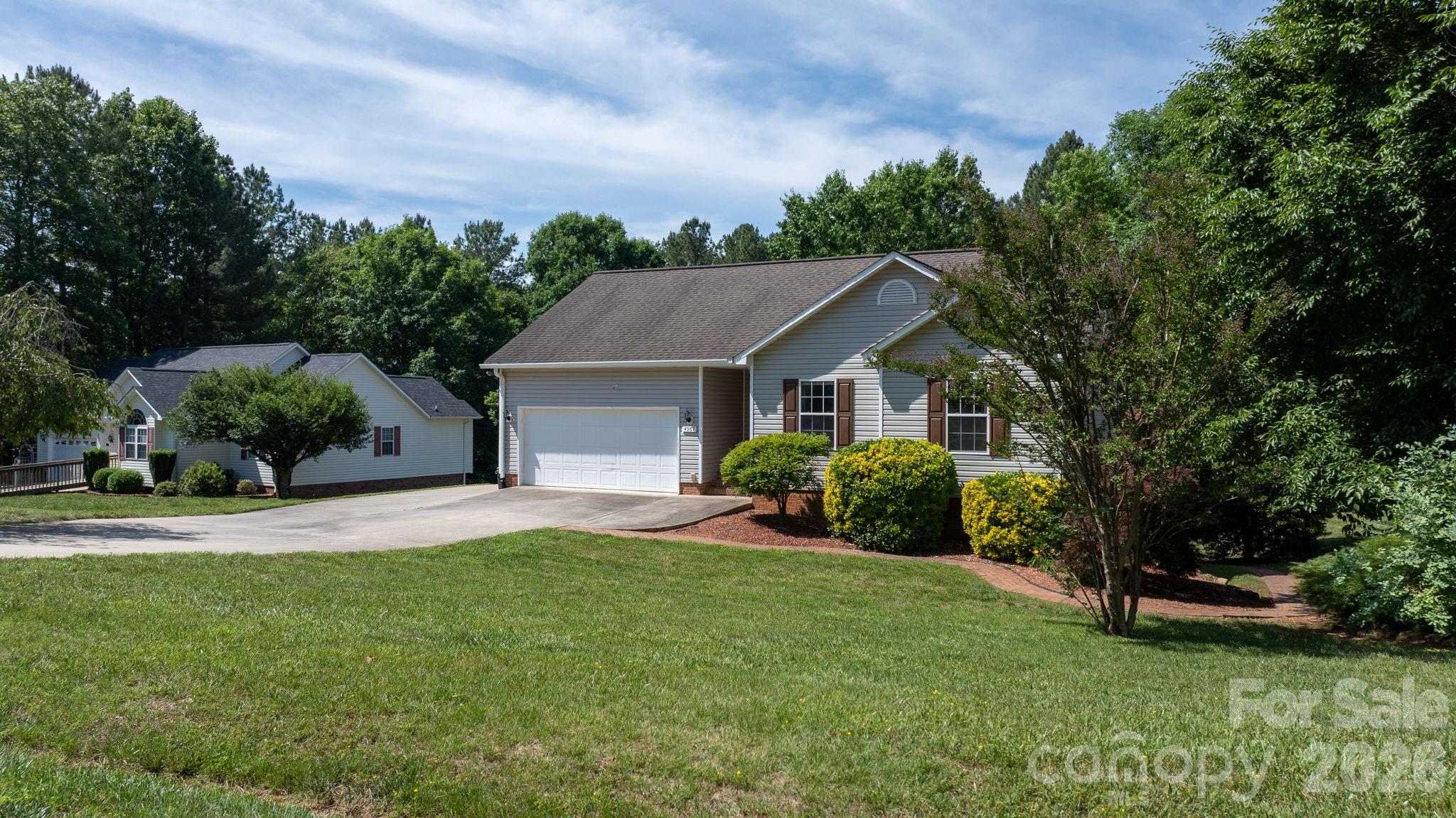 4967 Addison Lane Hickory, NC 28601 - Photo 26 of 43 a front view of a house with a yard and garage