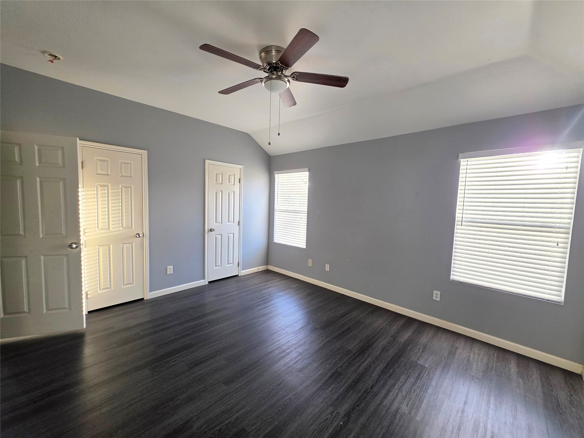 9514 Manorstone Court Houston, TX 77044 - Photo 6 of 9 a view of an empty room with wooden floor and a window