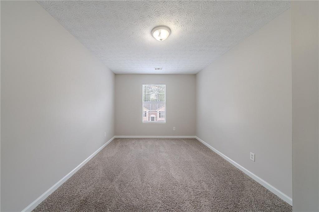 2183 Ramblewood Circle Decatur, GA 30035 - Photo 15 of 37 a view of an empty room with a window