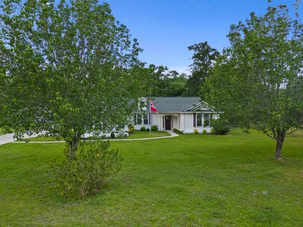 a view of a house with a big yard